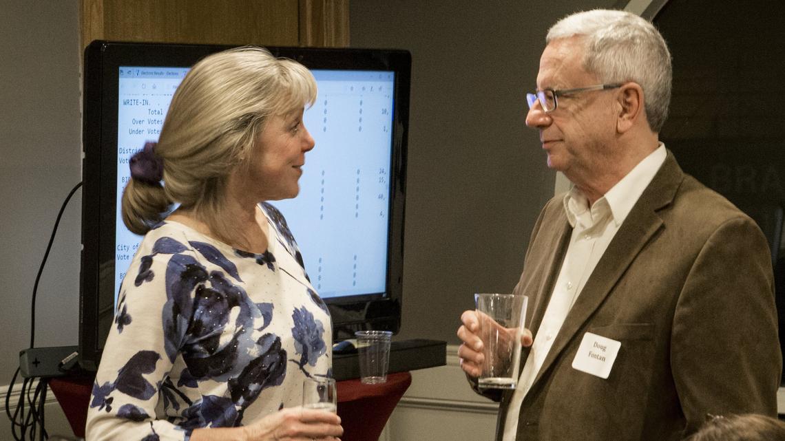 Birgit Fladager talks with Doug Fontan as she celebrates with friends and family Tuesday night at Skewers Kabob House in downtown Modesto as she was headed for her fourth term as Stanislaus County district attorney.