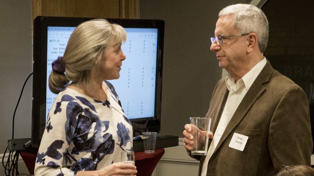 Birgit Fladager talks with Doug Fontan as she celebrates with friends and family Tuesday night at Skewers Kabob House in downtown Modesto as she was headed for her fourth term as Stanislaus County district attorney.