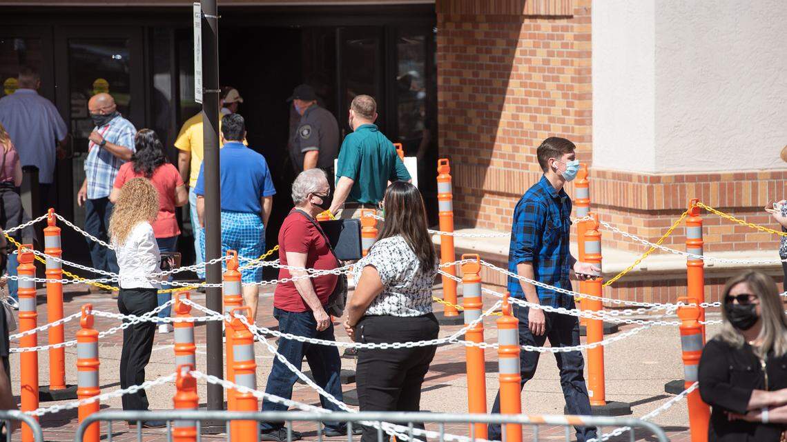 People line up at the COVID-19 vaccination clinic at Modesto Centre Plaza in Modesto, Calif., on Thursday, April 1, 2021.