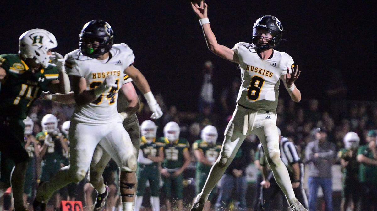 Hughson quarterback Robert Mcdaiel (8) throws to the end zone during a game between Hughson High School and Hilmar High School at Hughson High School in Hughson CA on October 14, 2022.