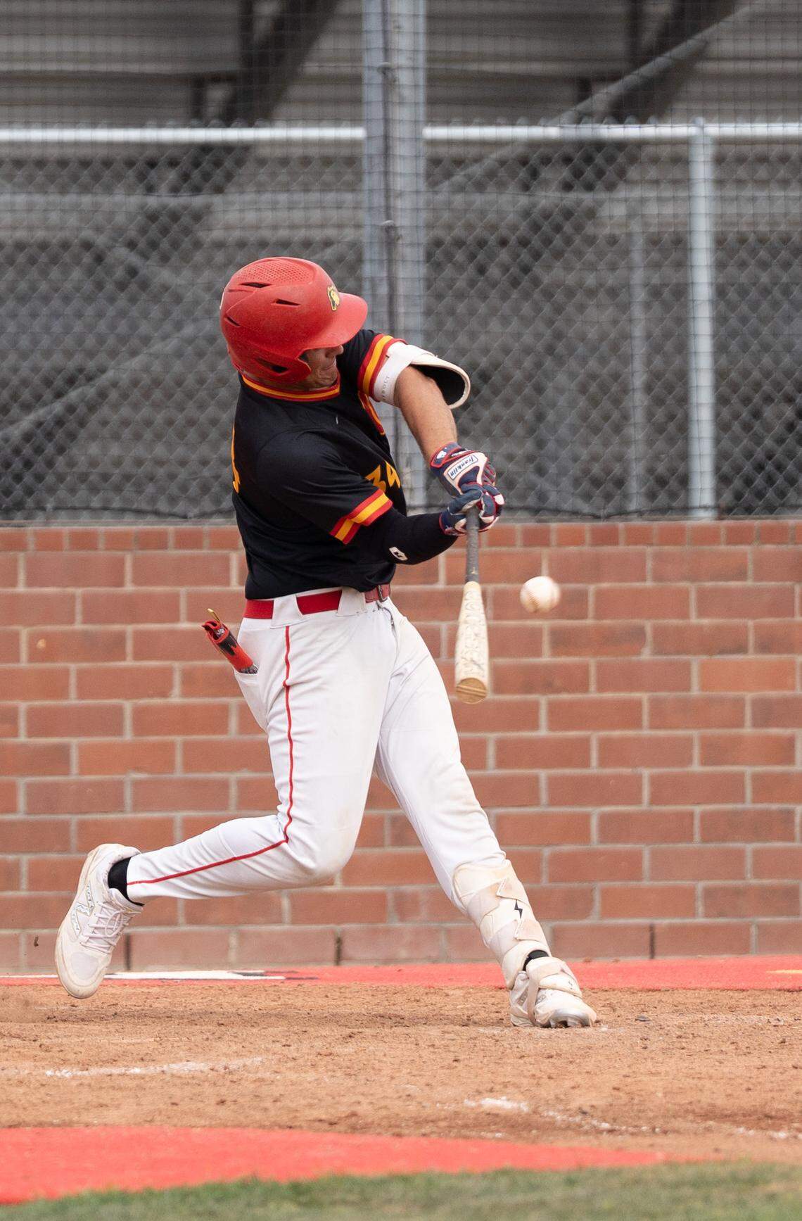 Oakdale’s Landon Schutte launches a double to center field during the Mark Dickens Tournament championship against Enochs at Oakdale High School on Thursday, April 9, 2026.