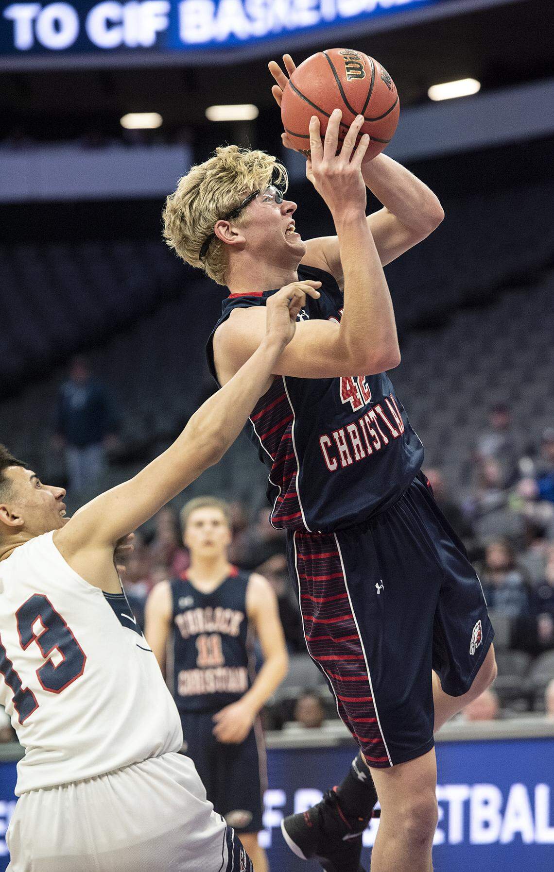 Turlock Christian’s Josh Comfort is fouled by Vacaville Christian’s Jordan Tobey during the Sac-Joaquin Section Division VI boys basketball championship game with at the Golden1 Center in Sacramento, Calif., Friday, Feb. 22, 2019.