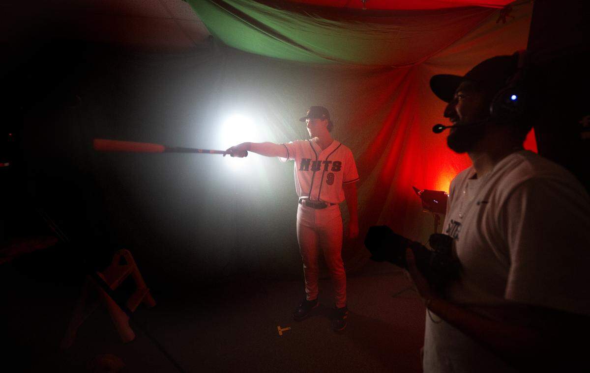 Modesto Nuts infielder Charlie Pagliarini works with videographer Ernesto Pulido during media day at John Thurman Field in Modesto, Calif., Tuesday, April 2, 2024.
