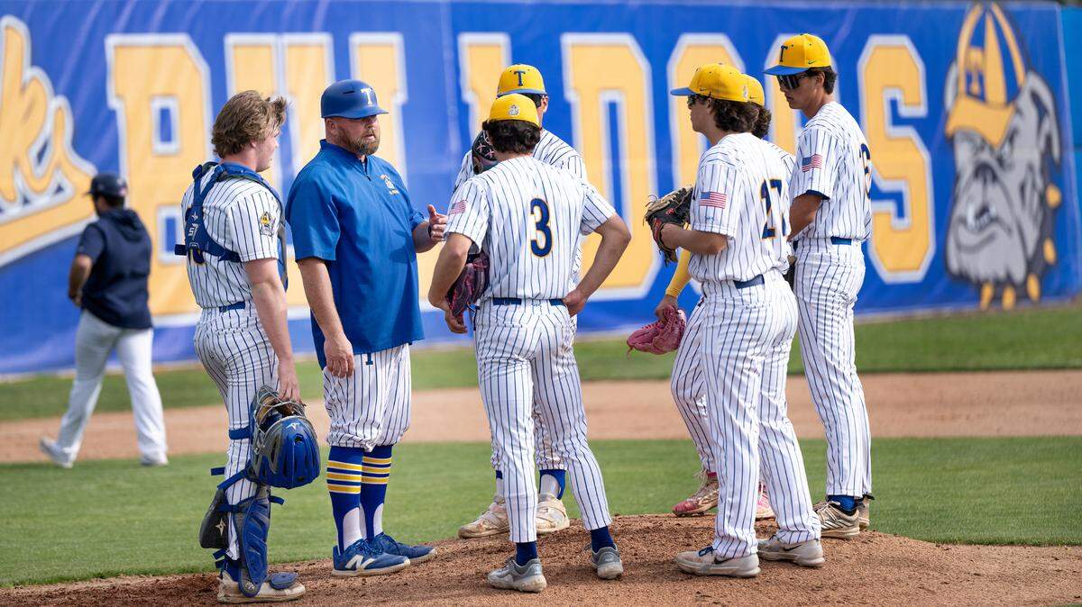 Turlock head coach Michael Souza talks with his players during the Central California Athletic League game with Gregori at Turlock High School in Turlock, Wednesday, March, 19, 2025.