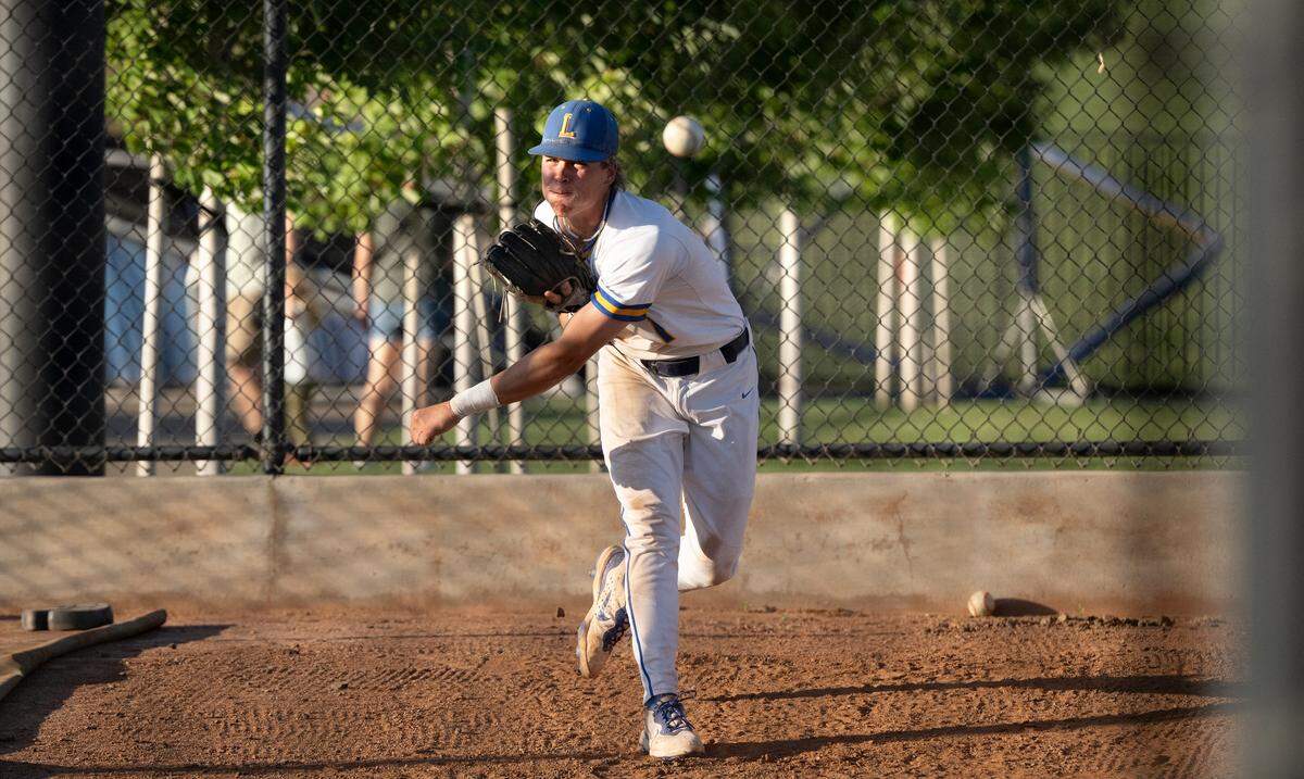 Lincoln’s Landyn Plaut throws in the bullpen during the Sac-Joaquin Section D-V championship game at Islander’s Field in Lathrop, Wednesday, May 21, 2025. Plaut came in as a reliever and recorded the save.
