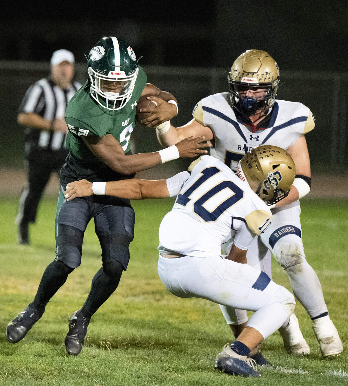 Manteca’s Elijah Stevenson runs past Central Catholic’s Josh Mendoza during the Valley Oak League game at Lathrop High School in Lathrop, Calif., Friday, Sept. 27, 2024.