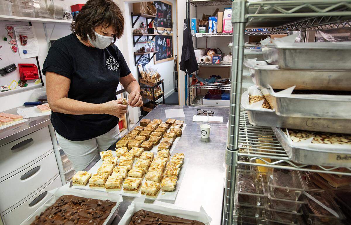 Owner Rhonda Vargas packages different varieties of fudge at Fudge-It confections in Ceres, Calif., on Tuesday Sept. 15, 2020.