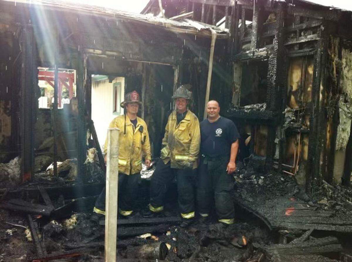 Stockton Fire Capt. Max Fortuna, left, with Chris Jesberg, and engineer Mario Gardea.