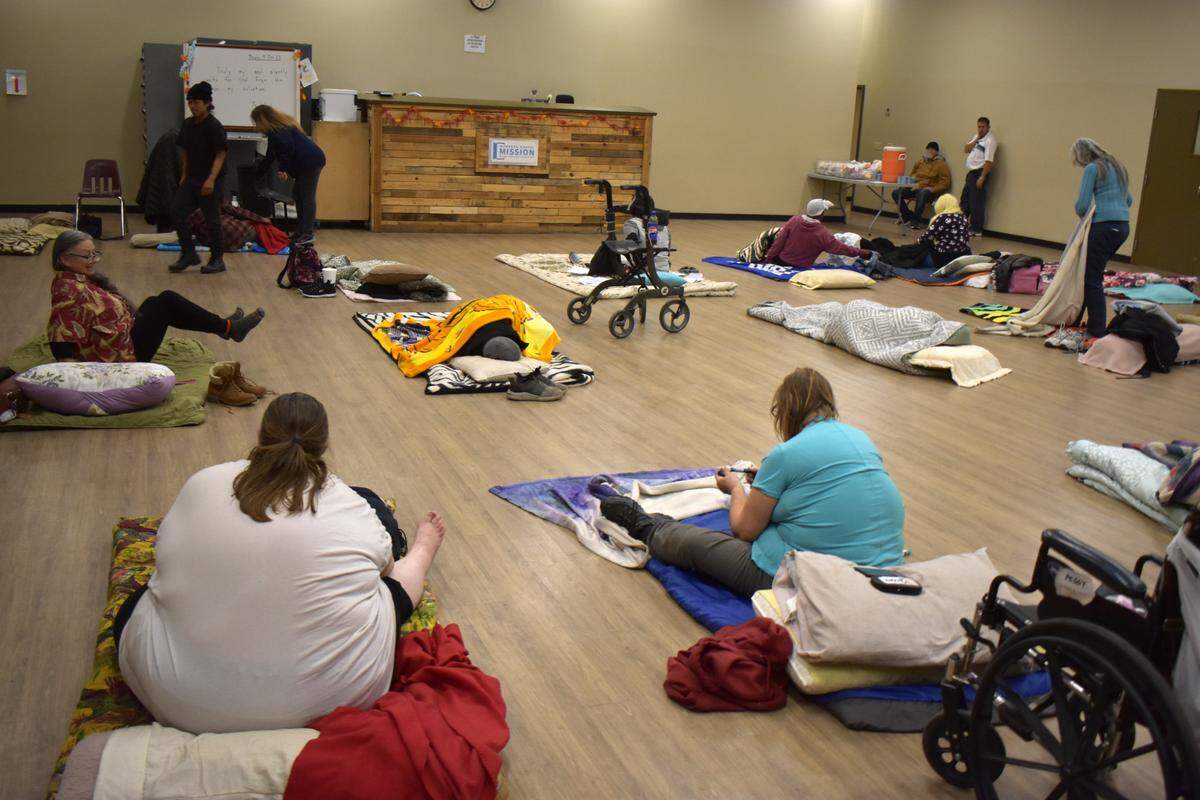 Women settle in for the night at the Modesto Gospel Mission on Yosemite Boulevard on Thursday, Nov. 9, 2023.