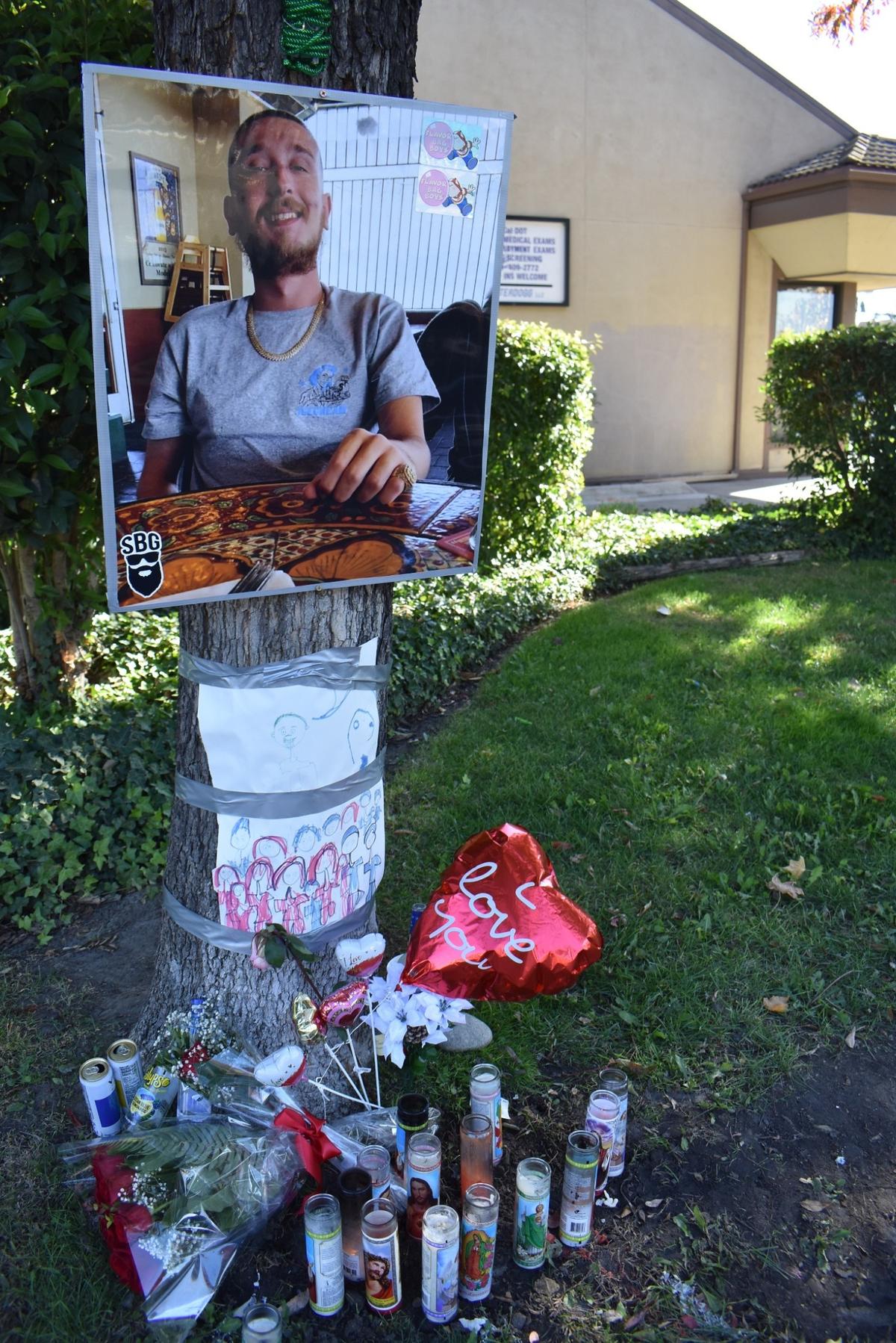 A memorial to 23-year-old Bryan Luque, who was fatally shot Friday night, Nov. 11, 2022, on the 1500 block of Coffee Road in Modesto, was created near where he died.