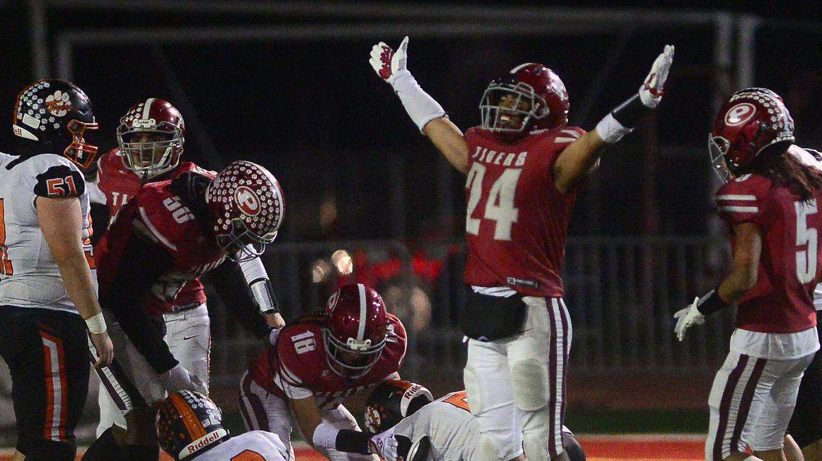 Patterson’s Lolo Mataele (24) celebrates after Patterson recovers a fumble during a CIF Division III Sac-Joaquin Section Football Playoff game between Patterson High School and Roseville High School at Patterson High School in Patterson CA on November 11, 2022. Patterson won 56-34.