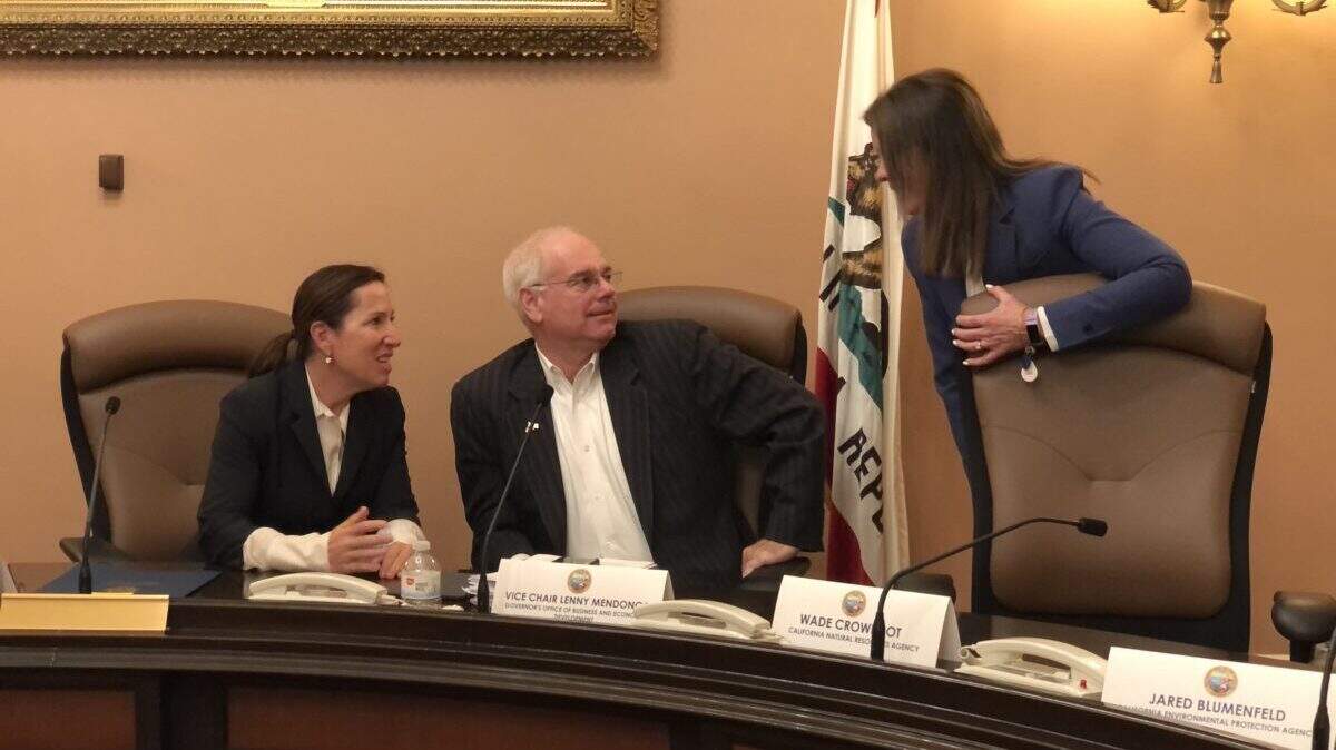 Lenny Mendonca, center, former Chief Economic and Business Advisor to Gov. Gavin Newsom, discusses trade and tourism with Lt. Gov. Eleni Kounalakis, left, and Caroline Beteta, president of Visit California, in March amid the coronavirus outbreak. Photo by Judy Lin for CalMatters