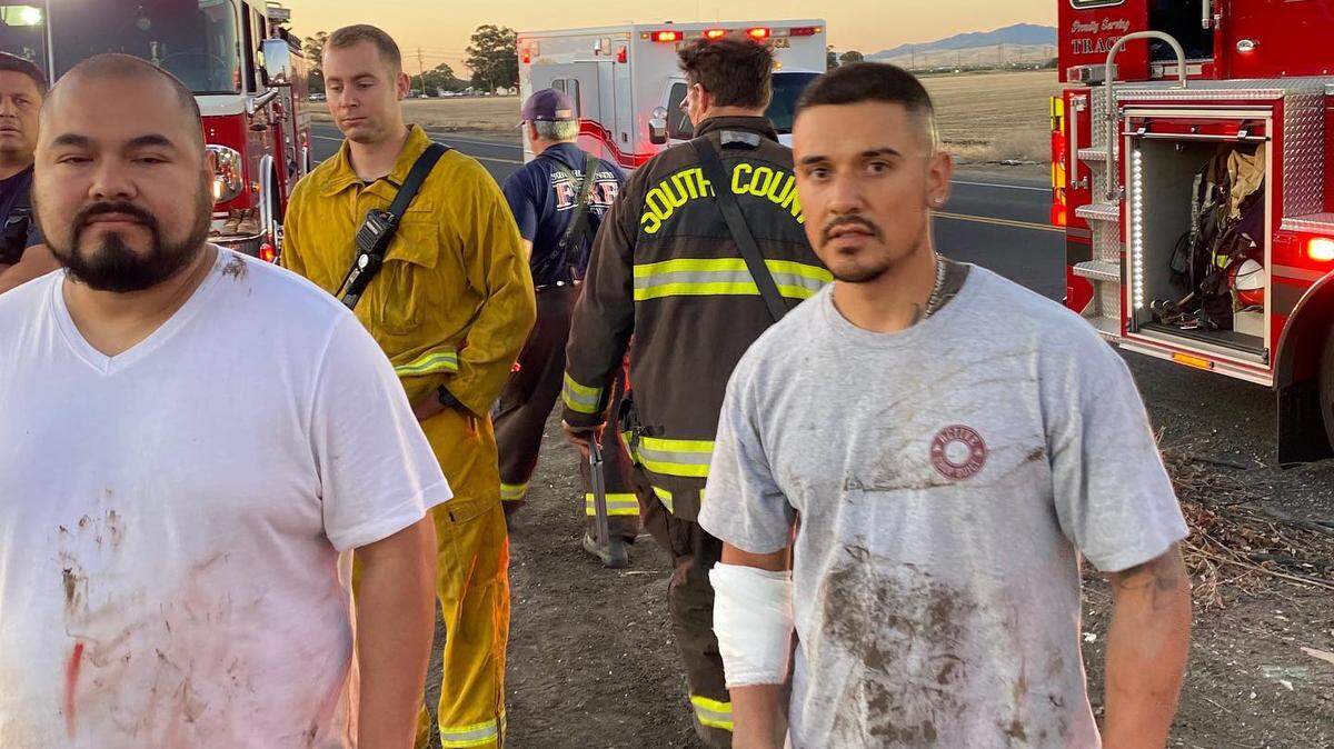 Jorge Mendoza (left) and Daniel Miranda rescued a woman from a submerged car near Tracy, Calif.