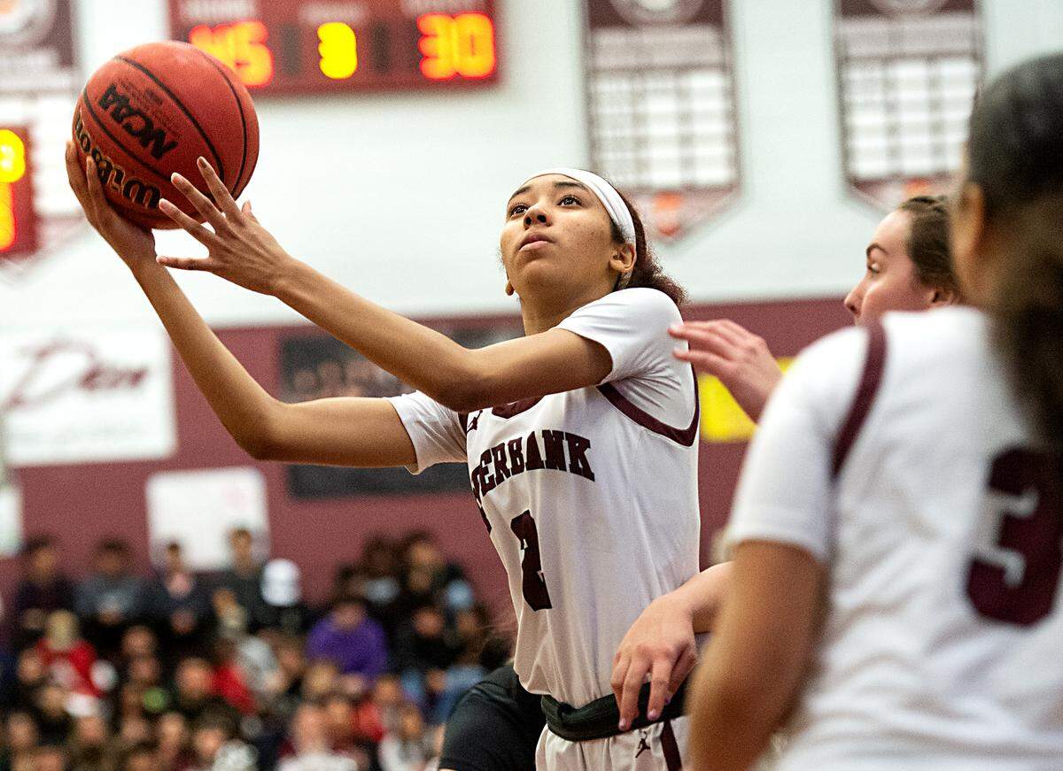 Riverbank’s Taylor Macias scores during the Sac-Joaquin section semifinal playoff game with Escalon in Riverbank, Calif., Tuesday, Feb. 21, 2023.