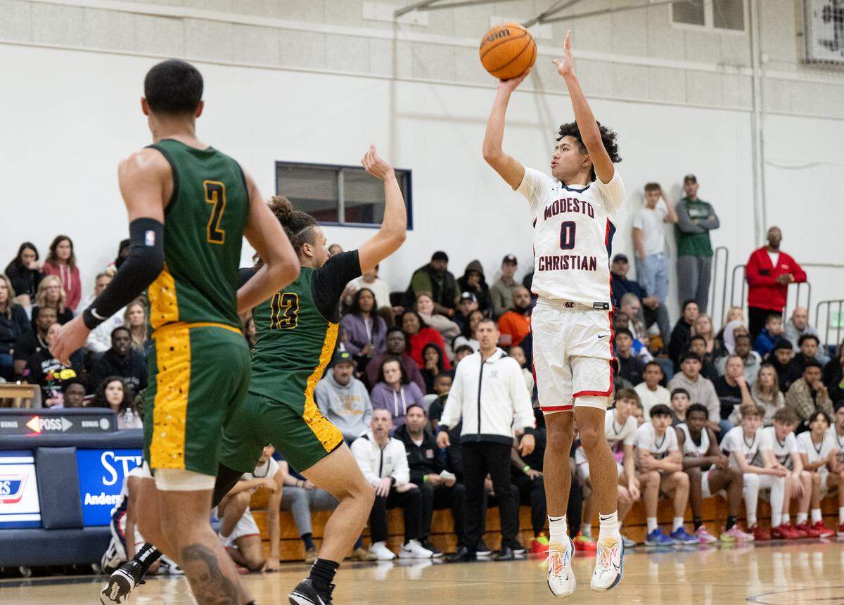 Modesto Christian’s Myles Jones scores a three-point shot during the Holiday Hoop Classic championship game with Vanden at Modesto Christian High School in Salida, Calif., Saturday, Dec. 30, 2023.