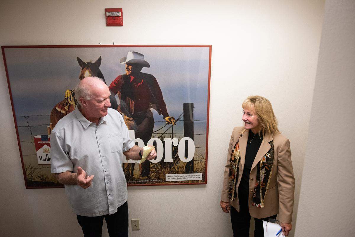 MTC owner Tom Eakin, left, talks with co-worker Kathy Olivera at MTC Distributing in Modesto, Calif., Tuesday, Oct. 25, 2022. Eakin has sold the 101-year-old Modesto company to Harbor Foods, a family owned distributer from Washington state.