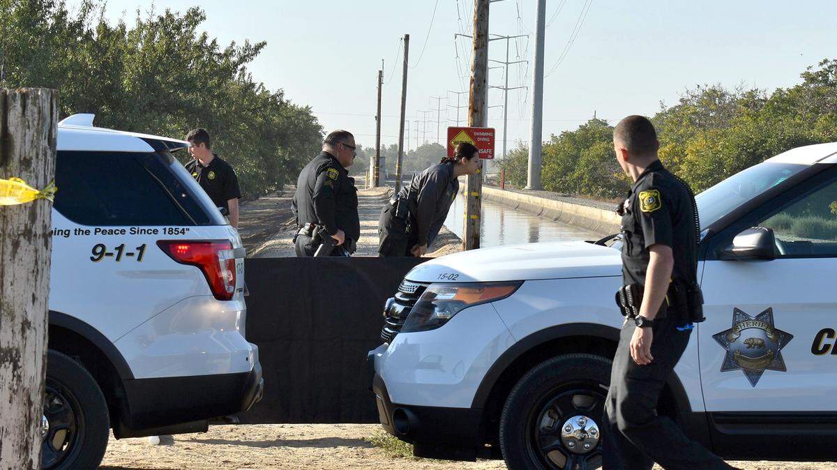 Stanislaus County Sheriff’s Department deputies work the scene at a canal near Keyes where the body of a man was found in the water Wednesday morning, Oct. 10, 2018.