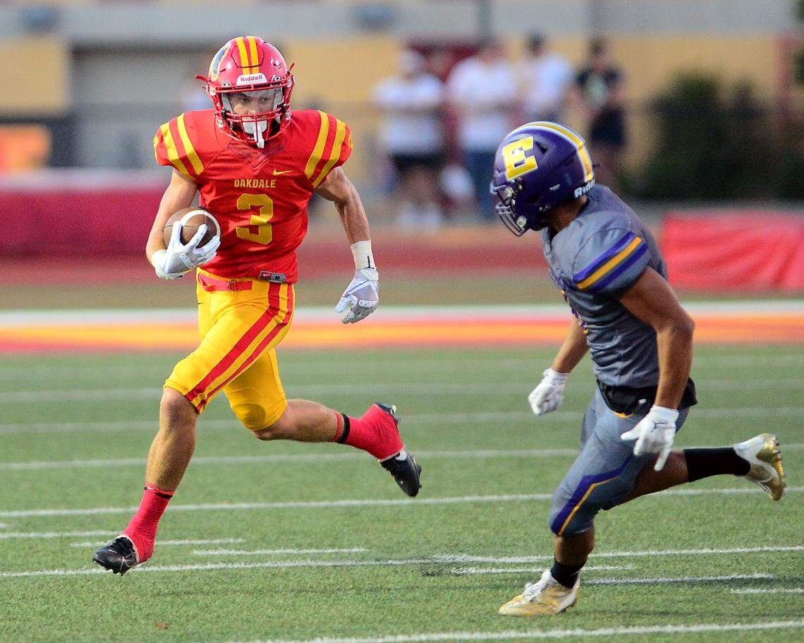 Oakdale running back Jacob Kindrick (3) eyes a defender on a kick return during a game between Oakdale and Escalon at Oakdale High School in Oakdale, California, on September 15, 2023.