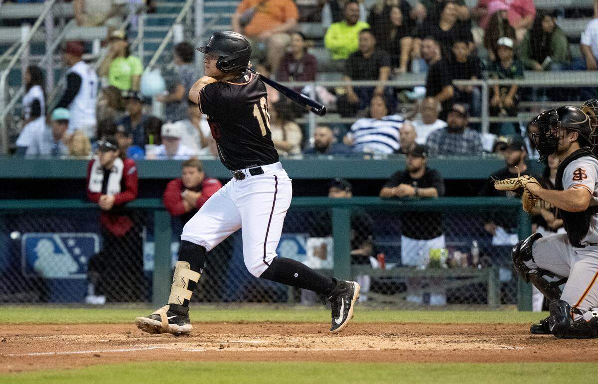 Modesto Nuts’ Luis Suisbel drives a single during the California League North Division series game with the San Jose Giants at John Thurman Field in Modesto, Calif., Thursday, Sept. 12, 2024.