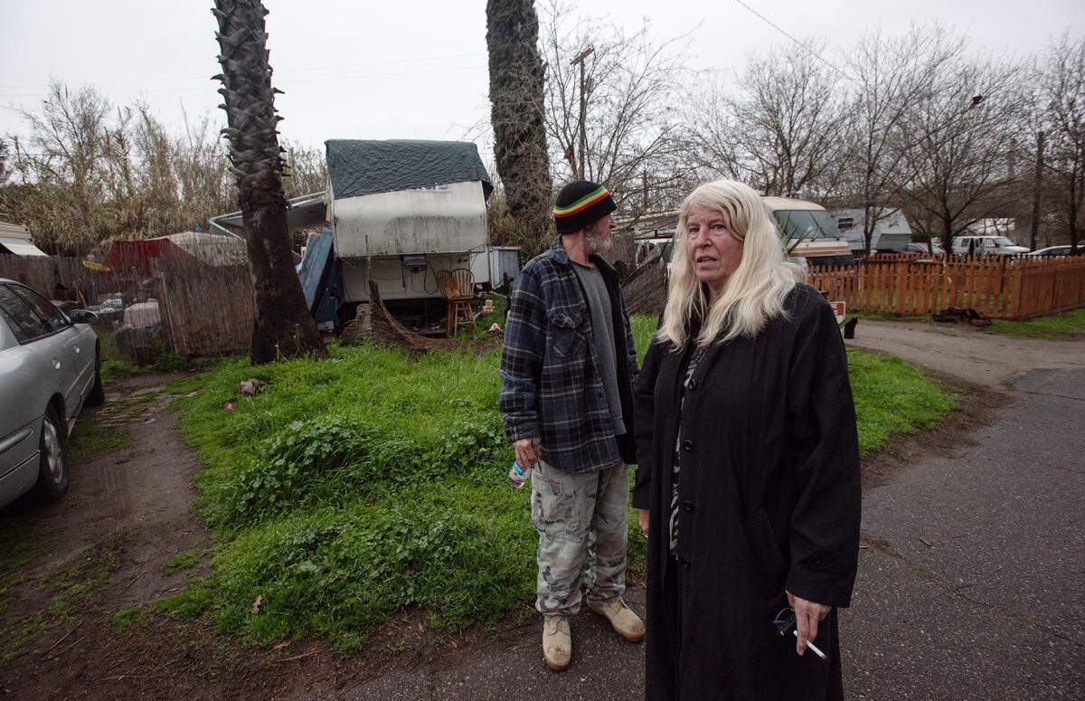 Terrace Trailer Park residents Lynn DeShaw and Ray Kopf live on a higher part of the RV park but were given an an evacuation order by Sheriffs deputies in Modesto, Calif., Friday, March 10, 2023. The Tuolumne River is expected to rise to 54 feet during overnight. Flood stage is at 55 feet along that section of the Tuolumne.