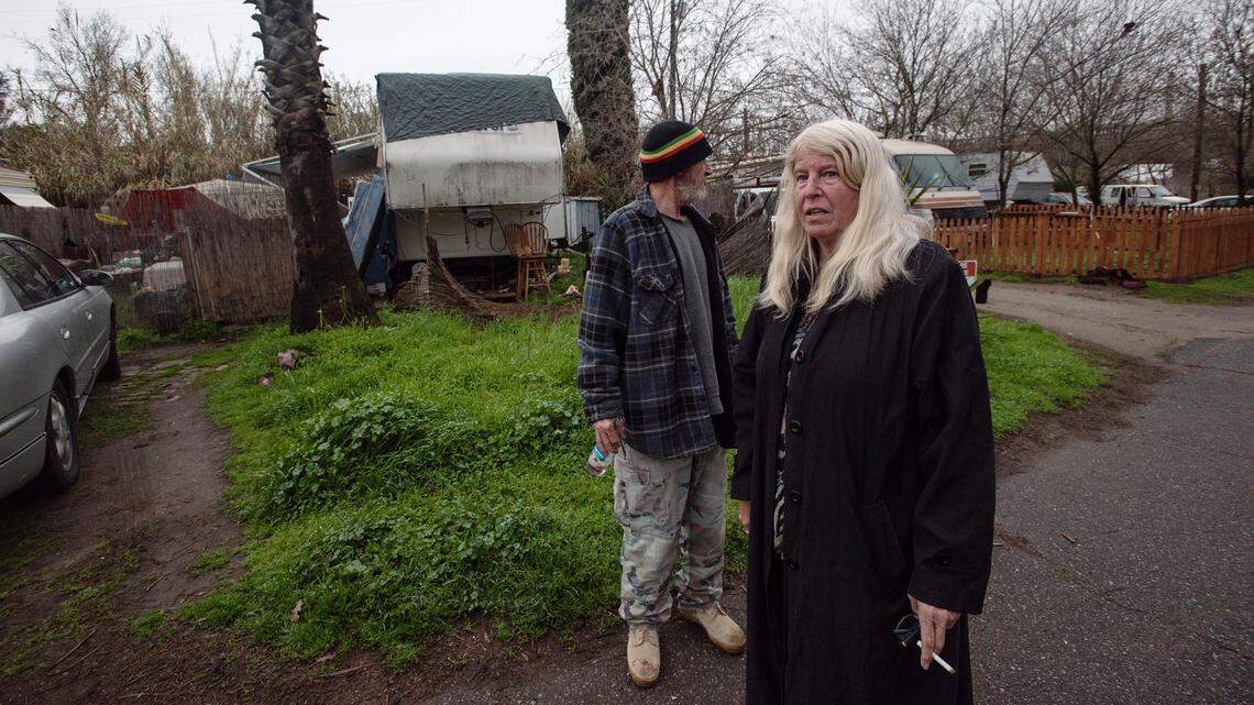 Terrace Trailer Park residents Lynn DeShaw and Ray Kopf live on a higher part of the RV park but were given an an evacuation order by Sheriffs deputies in Modesto, Calif., Friday, March 10, 2023. The Tuolumne River is expected to rise to 54 feet during overnight. Flood stage is at 55 feet along that section of the Tuolumne.