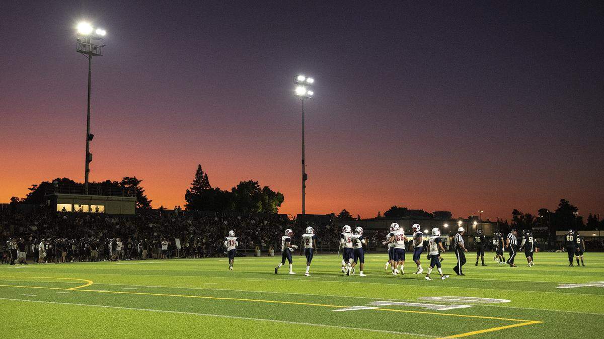 Beyer and Enochs face off during week one of high school football at Downey High School in Modesto, Calif., Friday, Aug. 23, 2019.