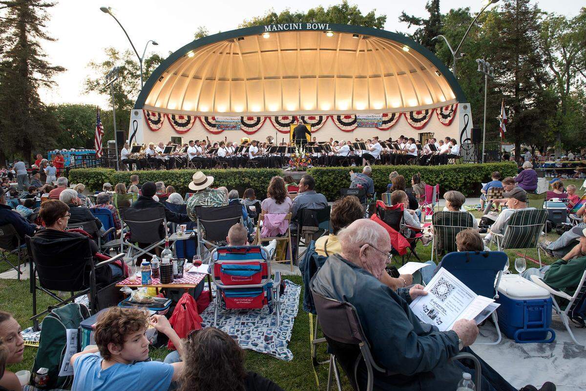 People enjoy a 2018 MoBand concert.