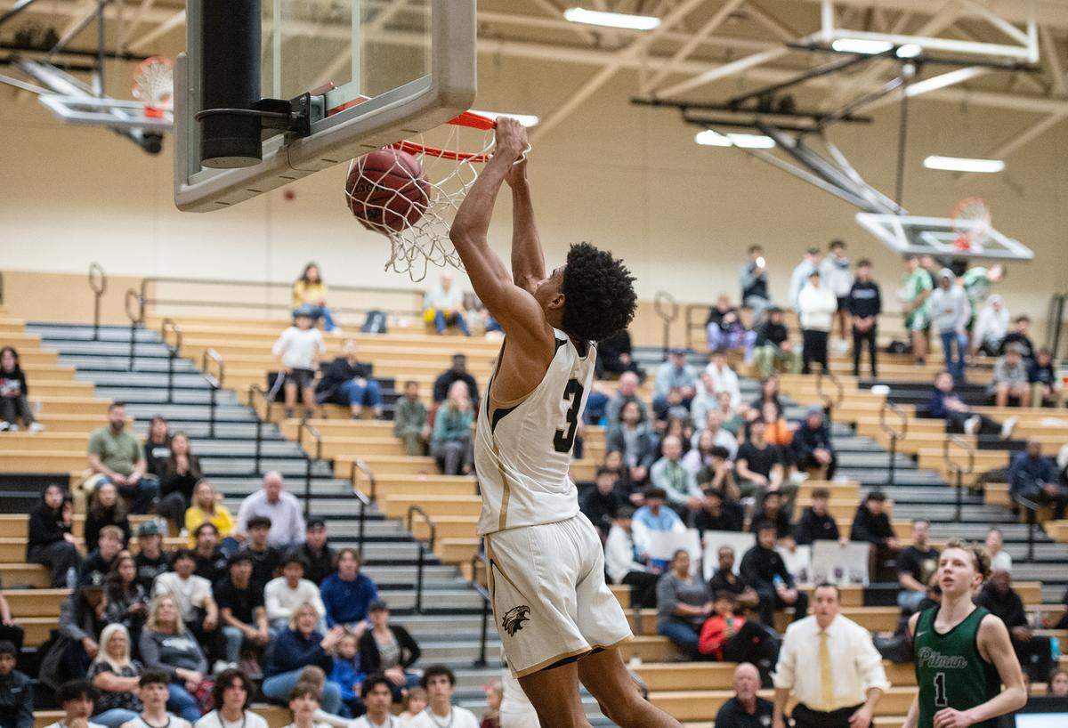 Enochs’ Kevin King dunks the ball after stealing the ball from Pitman’s Justin Anderson during the Central California Athletic League game at Enochs High School in Modesto, Calif., Friday, Feb. 10, 2023.