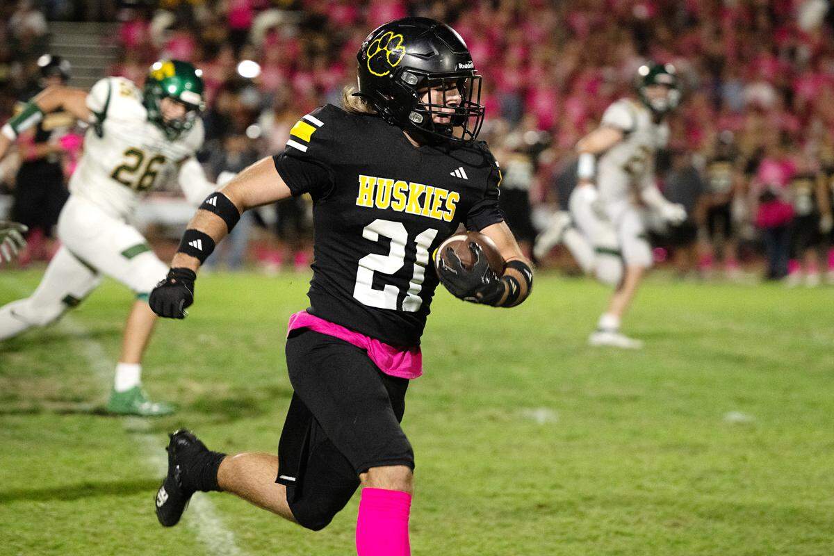 Hughson’s Eli Wilbanks runs the ball during the Trans Valley League game with Sonora in Hughson, Friday, Oct. 11, 2024.