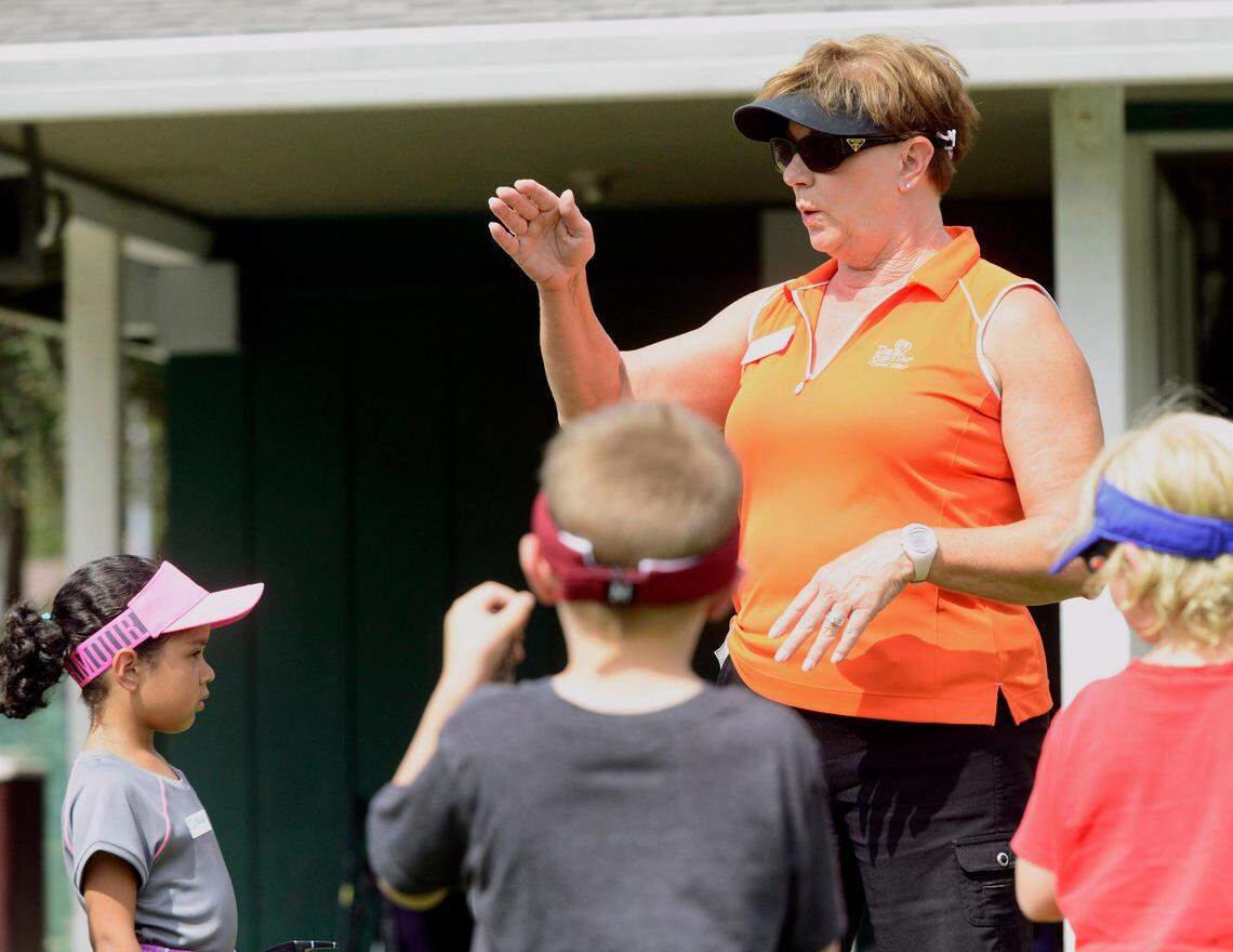 Volunteer Diane Pohl talks to the young golfers during the First Tee Central Valley youth golf program in 2014.