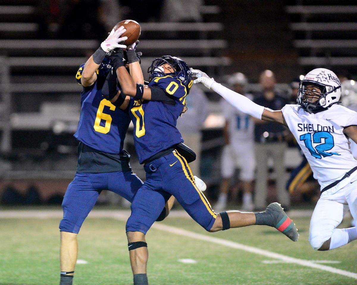 Turlock receiver Jeremiah Stine (0) makes the catch during a CIF Sac-Joaquin Section Football Division I playoff game between Turlock High School and Sheldon High School at Turlock High School in Turlock, California on Nov. 3, 2023.