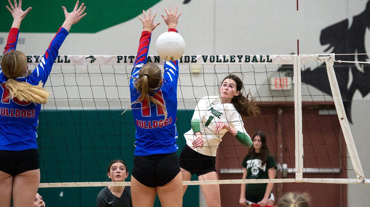 Pitman’s Maryn Hall spikes a ball down the line during the CIF Sac-Joaquin Girls Volleyball Division I playoff match with Folsom at Pitman High School in Turlock, Calif., Thursday, Oct. 27, 2022. Pitman won the match 3-1.
