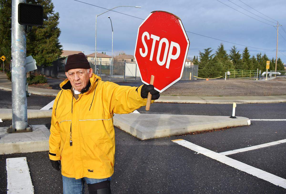 Bob Luna, 84, works as a crossing guard for Stanislaus Union School District at the corner of Prescott Road and Snyder Avenue the morning of Jan. 16, 2019. He’s been at it for 14 years, he says.