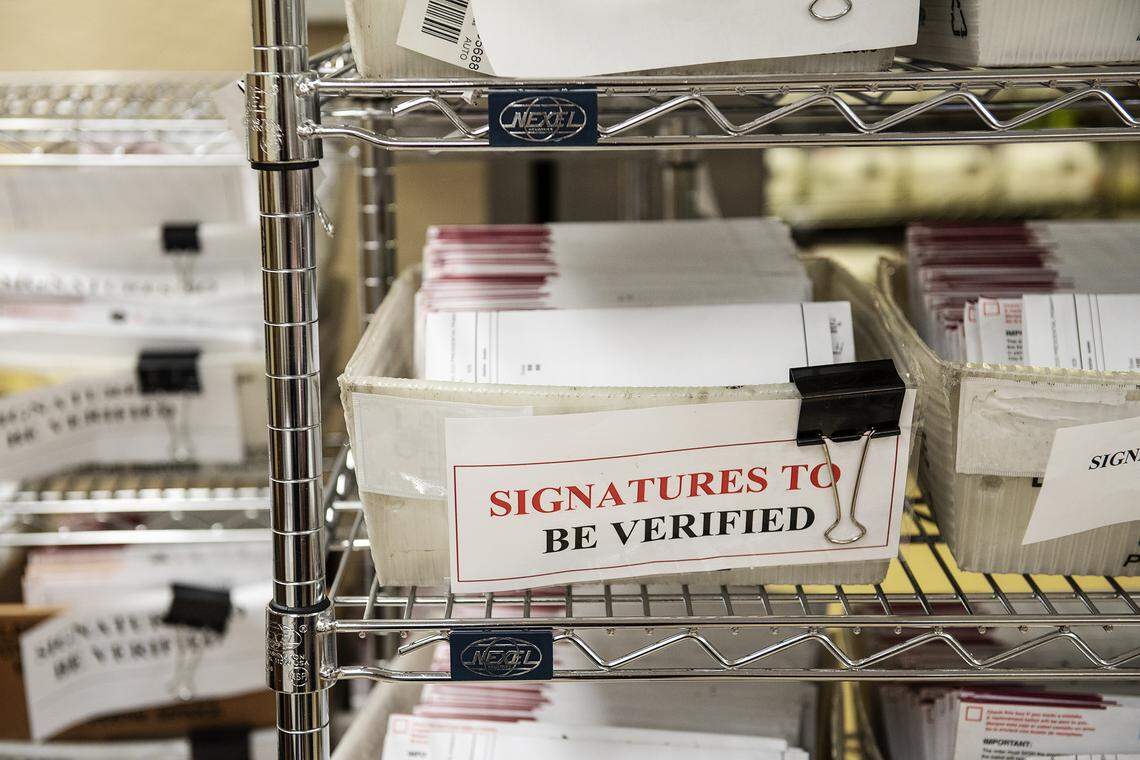 Vote-by-mail ballots wait to be verified before they are counted at the Stanislaus County Clerks Recorder’s office in Modesto, Calif., on Thursday, March. 5, 2020.