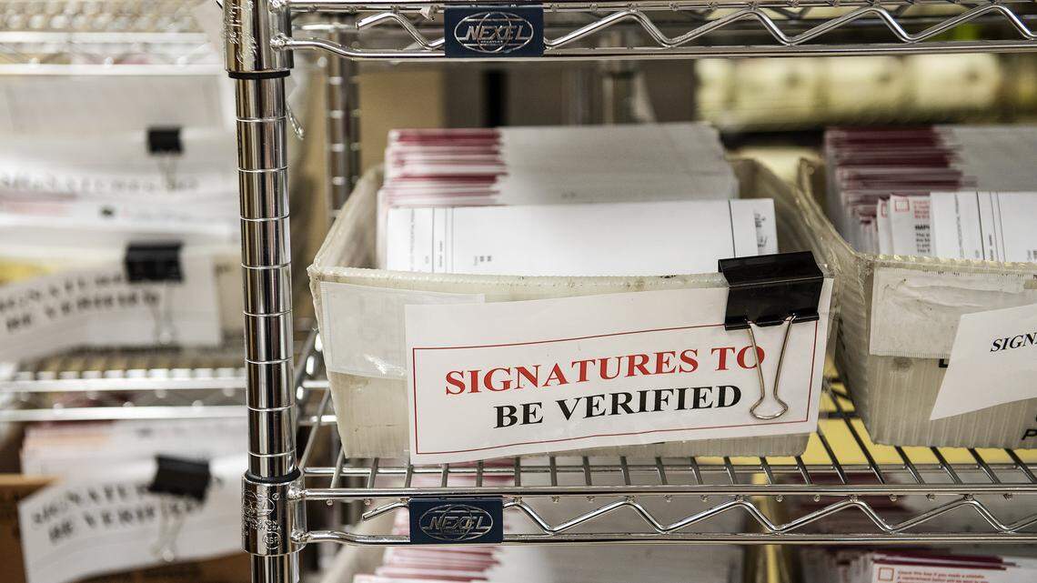 Vote-by-mail ballots wait to be verified before they are counted at the Stanislaus County Clerks Recorder’s office in Modesto, Calif., on Thursday, March. 5, 2020.