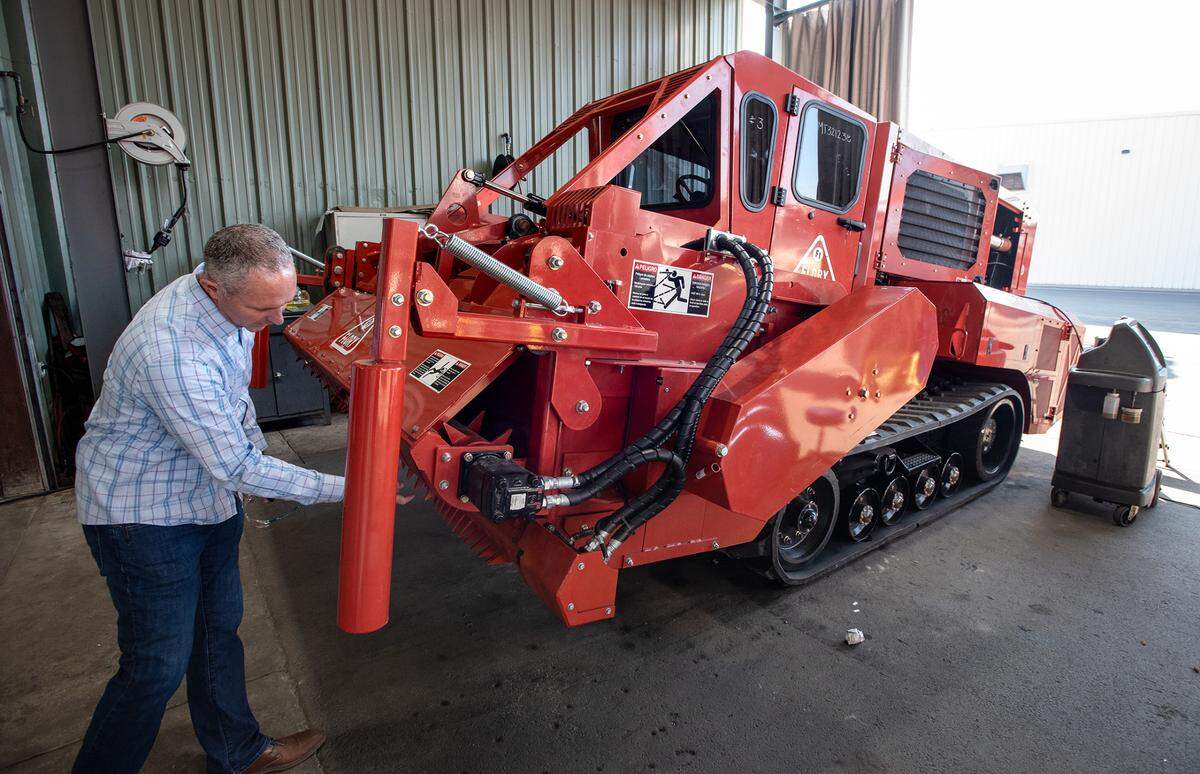 Flory Industries director of manufacturing John Bowman shows the brush shedder in Salida, Calif., Thursday, Feb. 9, 2023. Flory Industries makes nut harvesting equipment in Salida, and is acquiring COE, a Sacramento Valley company that specializes in making shakers and nut catching equipment.