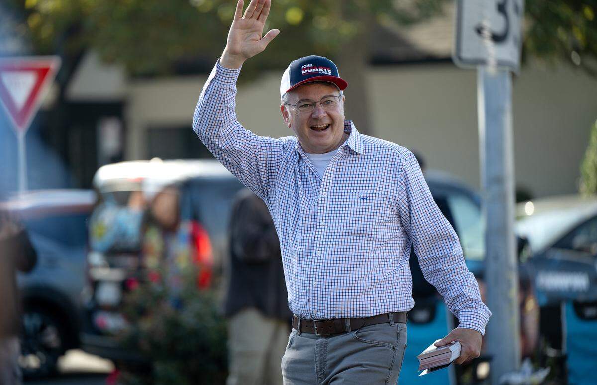 U.S. Rep. John Duarte greets people along the Veterans Day Parade route in Modesto, Calif., Saturday, Nov. 11, 2023.