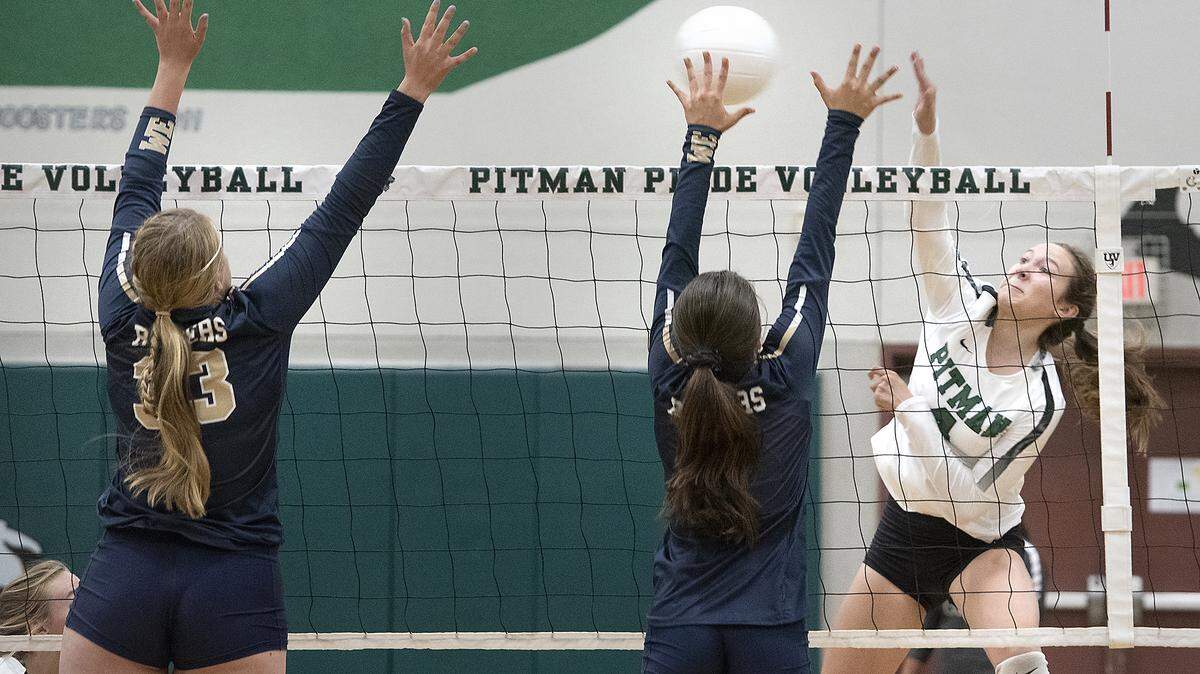 Pitman’s Brionna Sims spikes the ball past Central Catholic defenders during the non-conference match at Pitman High School in Turlock, Calif., Thursday, Sept. 12, 2019. Central Catholic won the match 3-0.