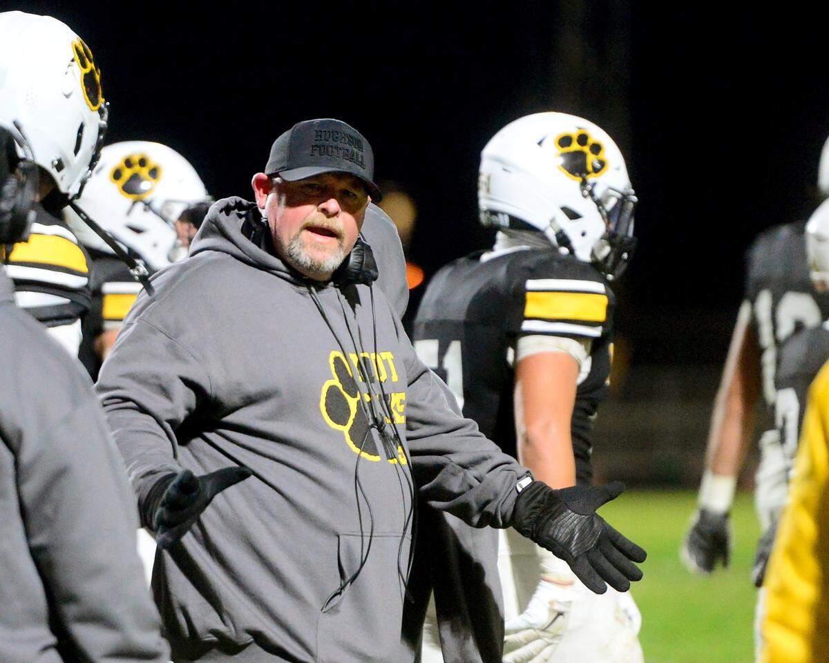 Hughson Head Coach Shaun King talks to his players on the sidelines during a 2024 CIF Sac-Joaquin Section Division V Playoff game between Hughson High School and El Dorado High School at Hughson High School in Hughson California on November 15, 2024. Hughson won the game 28-6.