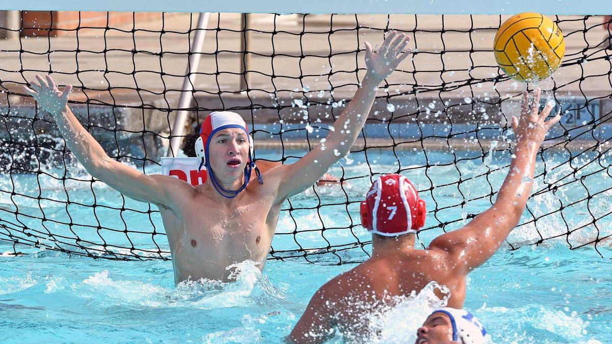 Beyer’s goalie Dylan Brower prepares to block a shot to the goal by Orange Lutheran’s Kyle Tooma on Friday morning October 18, 2019 during a water polo match at Pitman High School in Turlock, Calif.