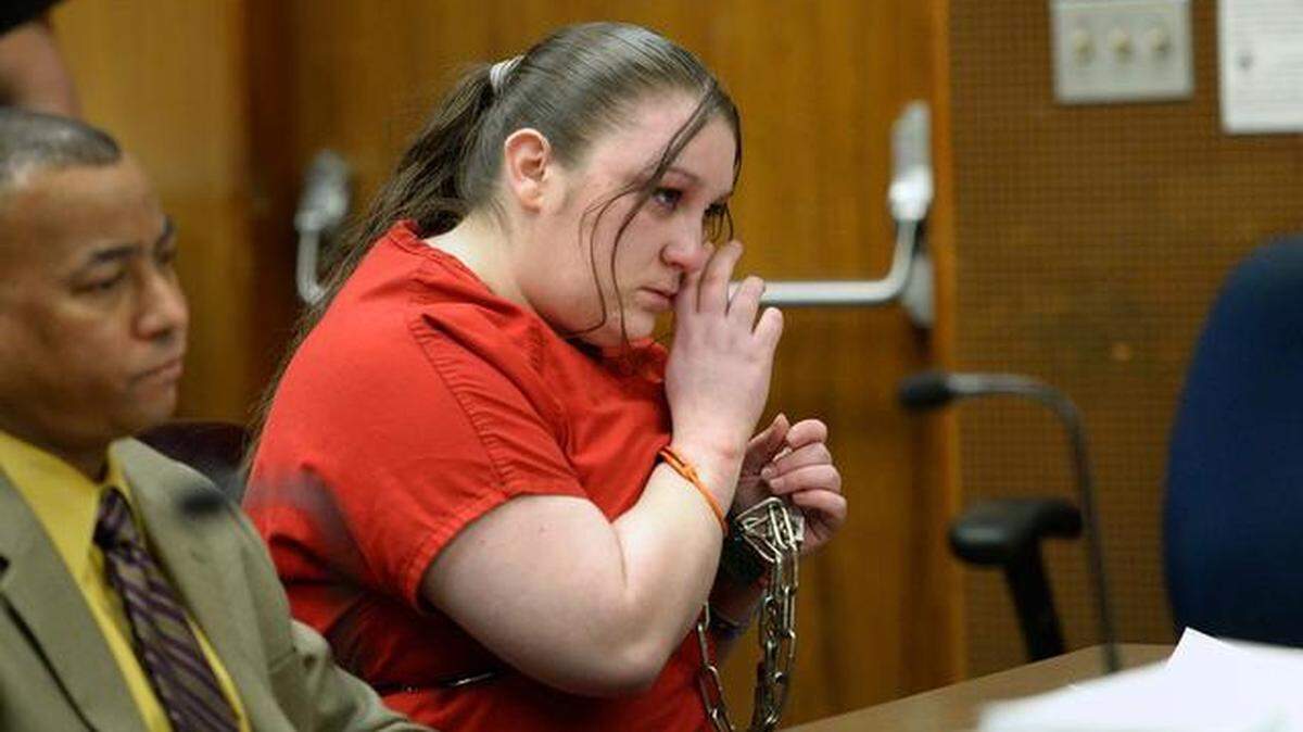 Brandy Lee Rose Devine wipes tears away after giving her apology to her children and family at her sentencing before Judge Dawna Reeves. Devine received a 15 years to life sentence for the death of her 2-year old daughter, Stephanie Torres.