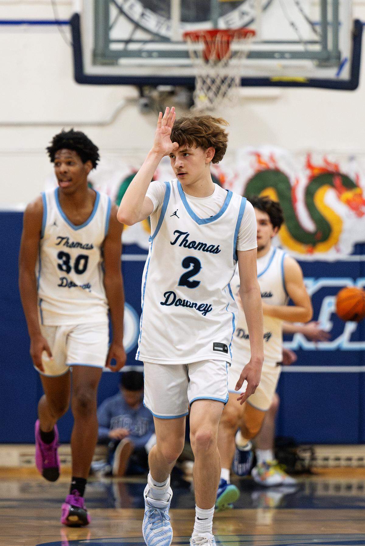 Downey’s Andrew Miller signals to the bench after a three-point basket during the Central California Athletic League game with Pitman at Downey High School in Modesto on Friday, Jan. 30, 2026.
