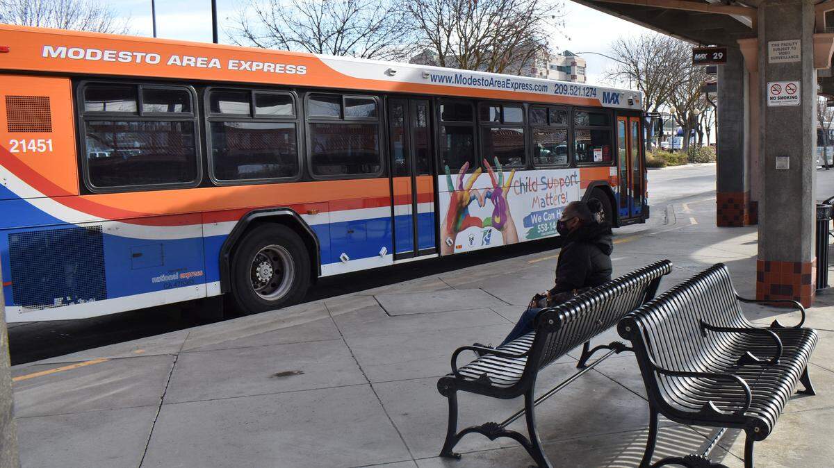 Tina Marks waits for her bus at the Modesto Transportation Center downtown on Monday morning, Dec. 28, 2020.