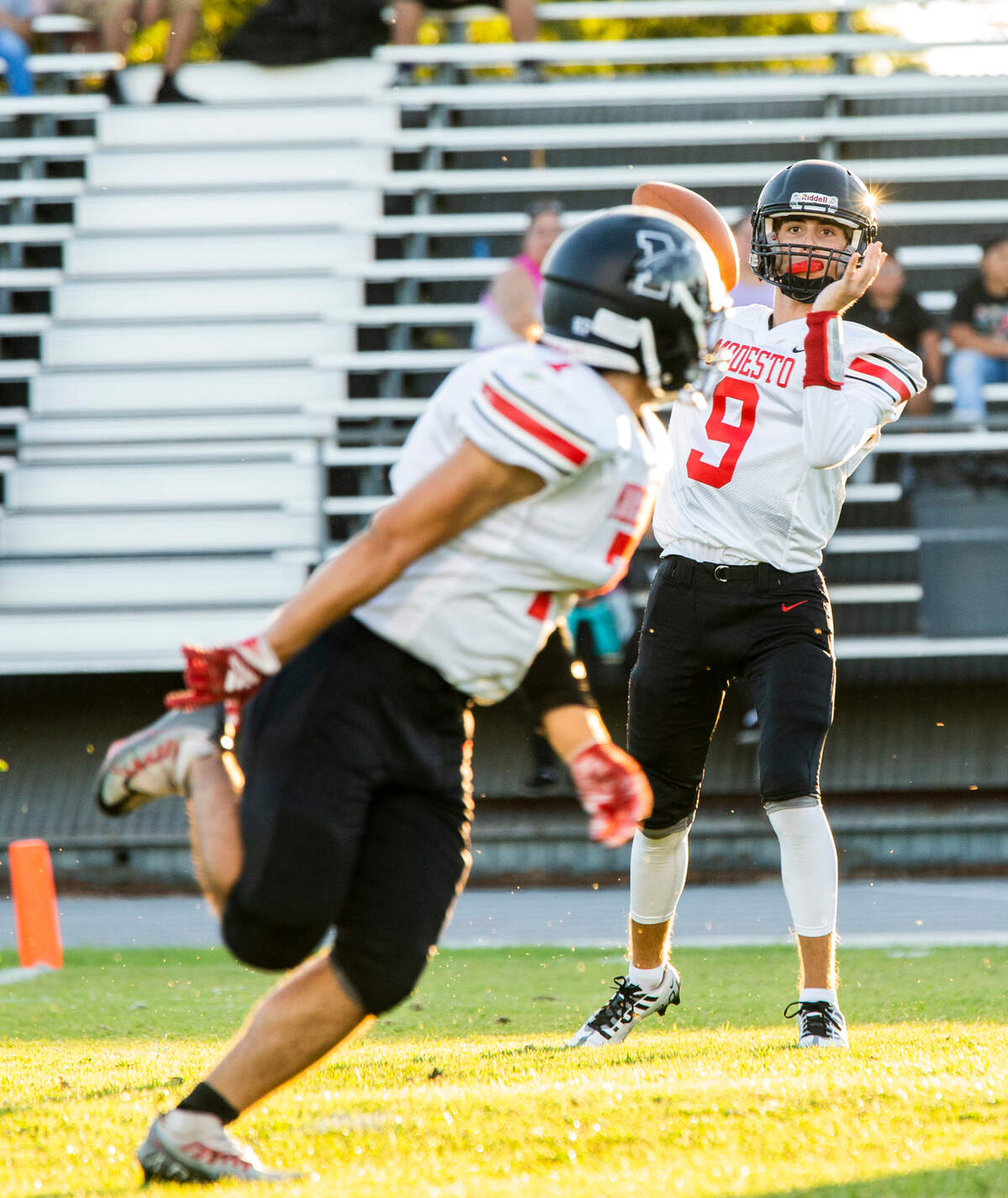 Eli McCabe, 9, throws a pass to Zion Garan. 7, of Modesto High during play against Johansen High Friday August 19, 2022.
