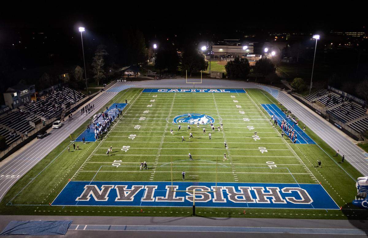 For the first time in 14 months, high-school-age football players strap on their pads to play a Friday night football game Feb. 12, 2021, at Capital Christian High School in Sacramento County for the California Association of Private Sports debut weekend. The club, composed of about a dozen teams from Central Valley communities, features more than 600 high-school-age players, mostly from private schools, sidelined from sports by California COVID-19 guidelines. Cautious about media coverage, the club denied the Bee’s request to photograph the event.