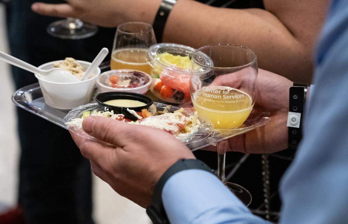 Guests sample food and drinks during the 2023 Edible Extravaganza fundraising event for the Center for Human Services.