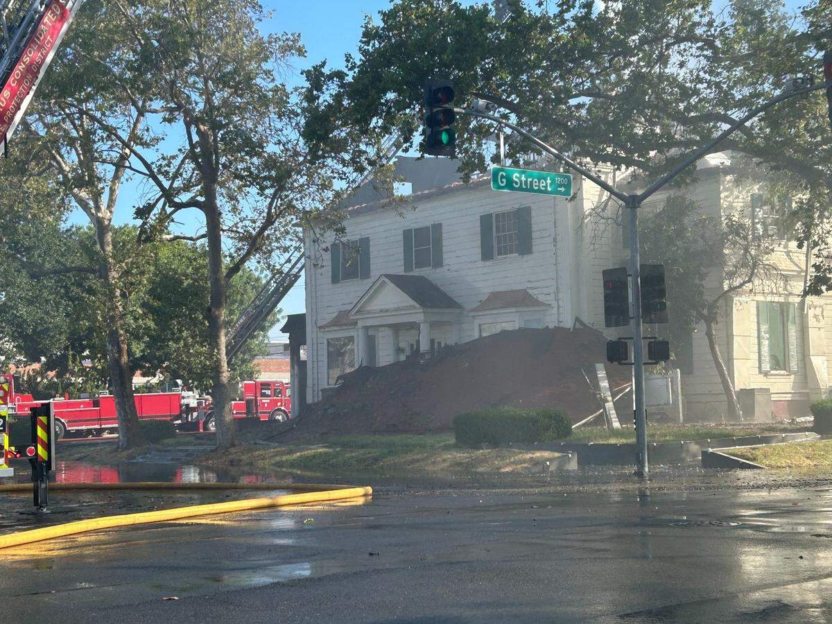 After an explosion blew the roof off the Colonial Chapel building, it lies in the front yard of the old home.