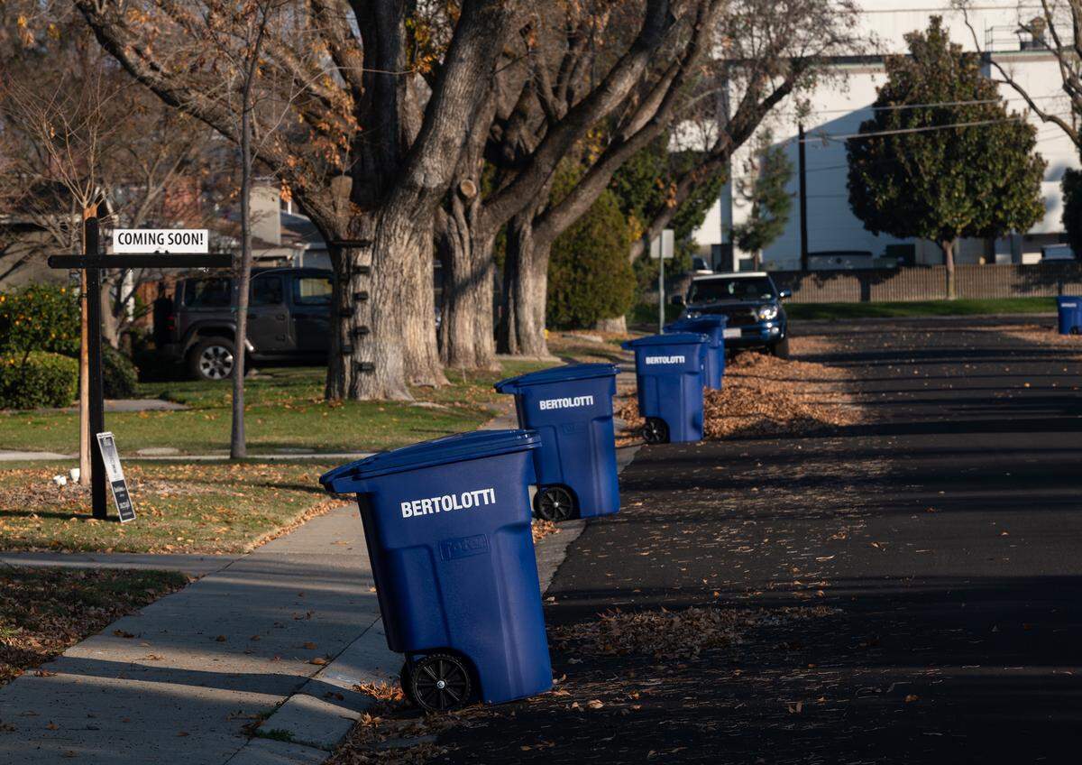 Refuse cans for recyclables were delivered to residents in Modesto, Calif., Friday, Dec. 16, 2022.