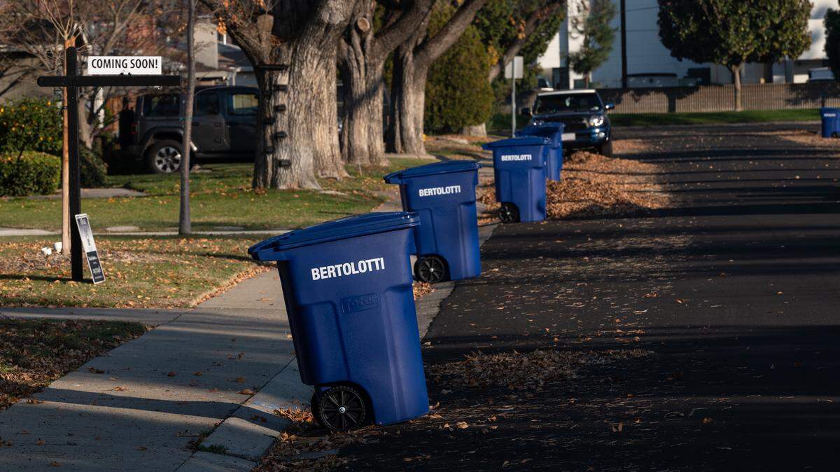 Refuse cans for recyclables were delivered to residents in Modesto, Calif., Friday, Dec. 16, 2022.