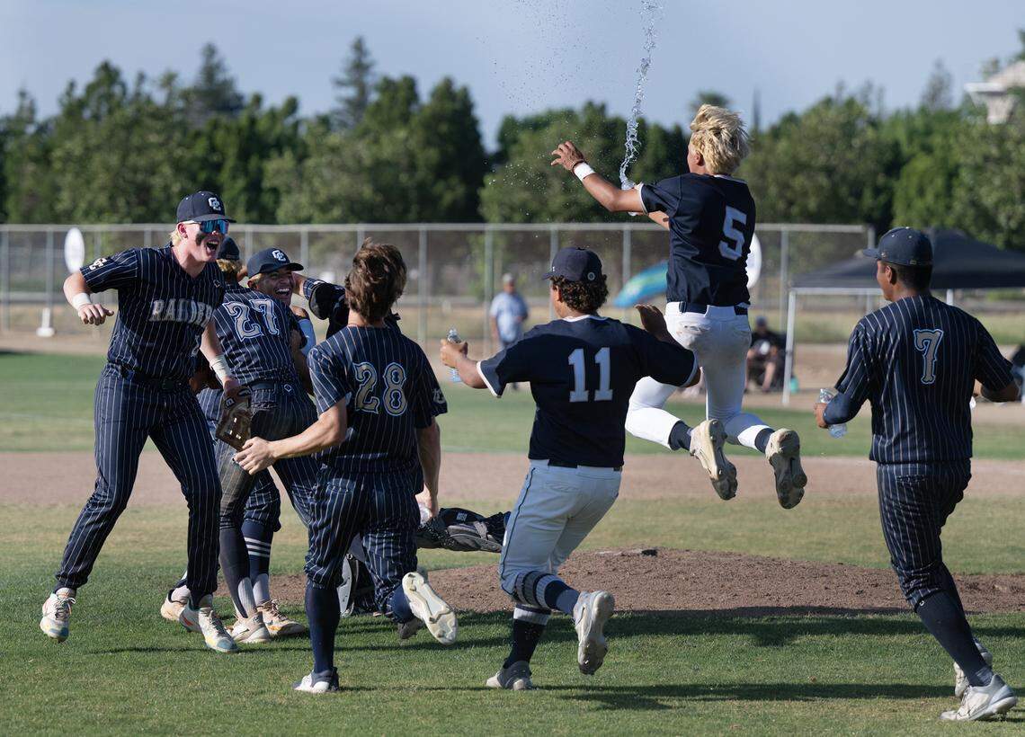 Central Catholic players celebrate their 5-2 victory over Oakmont for the Northern California Regional Division III title at Central Catholic High School in Modesto, Calif., Saturday, June 3, 2023.